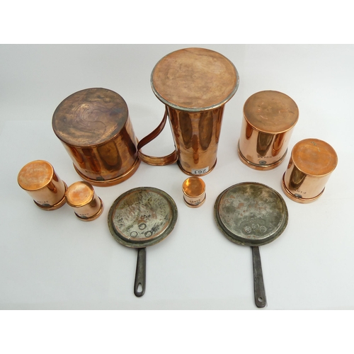 261 - A 19th century set of copper measures, two copper sauce pan lids and a single handled 25.5 cm jug 