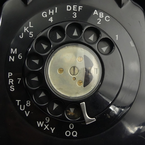 268 - A black bakelite G.E.C. telephone and a black plastic example. UK Postage £18.