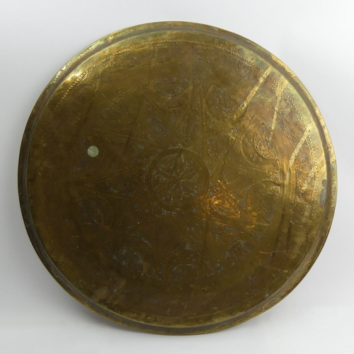 277 - A large Indian brass tray 58 cm and a decorative copper wall plate. Collection only.