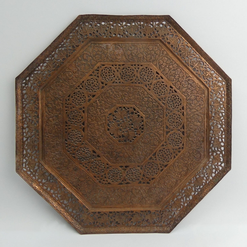 277 - A large Indian brass tray 58 cm and a decorative copper wall plate. Collection only.