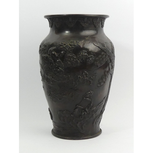 282 - Japanese Meiji period bronze vase decorated with peacocks amongst foliage. 25.5 cm. UK Postage £18.