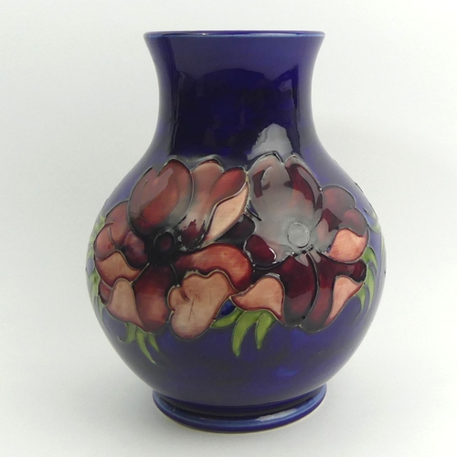 294 - A large Moorcroft Anemone blue ground art pottery vase. 24.5 x 19 cm. UK Postage £18.