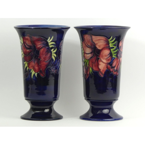 295 - A large pair of Moorcroft art pottery Anemone design vases. 28 x 17 cm. UK Postage £20.