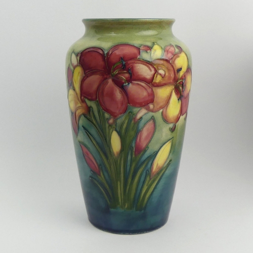 317 - Moorcroft art pottery African Lily design vase. 21 cm. UK Postage £14.