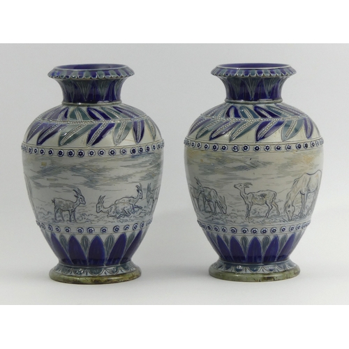 324 - A pair of Doulton Lambeth Hannah Barlow art pottery vases, decorated with a sgraffito design of hors... 