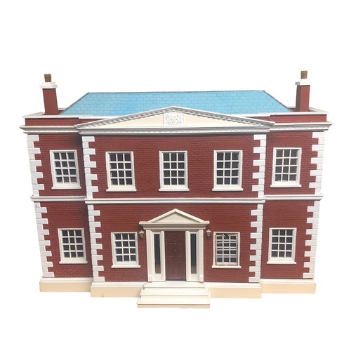 265B - A large dolls house with a fittted interior and furniture. Postage not available.