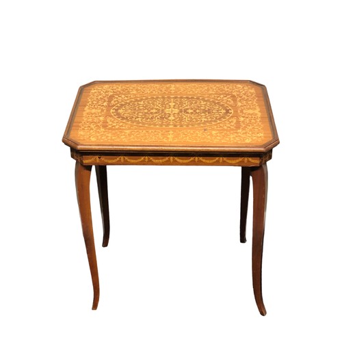 389 - An inlaid walnut games table, the interior fitted and with games pieces. Postage not available.