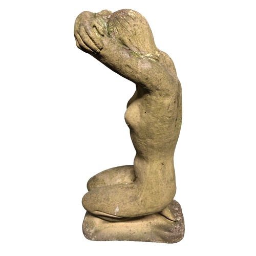 394 - A garden concrete statue of a maiden kneeling. 51 cm. Postage not available.