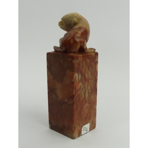 289 - A Chinese carved soapstone seal with a monkey to the top. 9.5 cm. UK Postage £12.