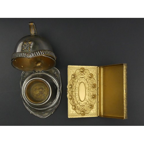 248A - A novelty match holder and striker in the form of a firemans helmet and a Bohemian paste set cigaret... 