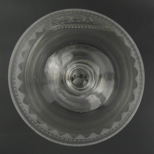 334 - Large Victorian engraved English hand blown glass goblet. 15.8 x 11 cm. UK Postage £12.