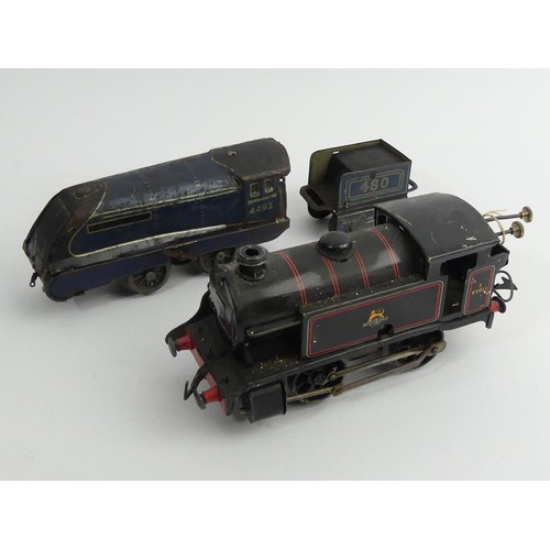 376 - Two O guage locomotive model clock work trains. UK Postage £12.