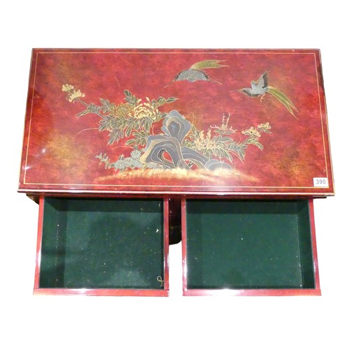 390 - A Chinese style lacquer ware cabinet of two drawers over two cupboard doors. 91 x 45 x 80 cm. Postag... 