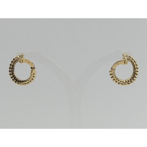1 - A pair of 9ct gold diamond set  earrings, 2.1 grams. 9 mm diameter. UK Postage £12.