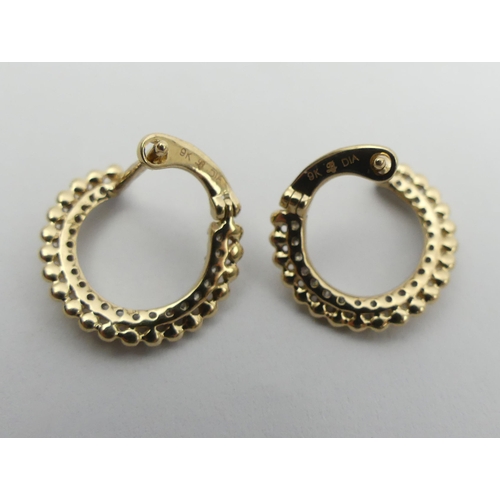 1 - A pair of 9ct gold diamond set  earrings, 2.1 grams. 9 mm diameter. UK Postage £12.