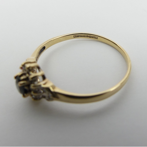 10 - 9ct gold sapphire and diamond ring, 1.7 grams. Size U, 8.8 mm wide. UK Postage £12.
