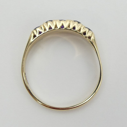 12 - 9ct gold amethyst five stone ring, 2.4 grams. Size U, 5.2 mm wide. UK Postage £12.