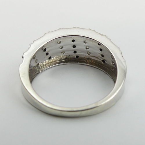 13 - 9ct gold black and white diamond set ring, 4.1 grams. Size N, 9 mm wide. UK Postage £12.