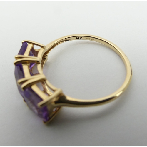 16 - 9ct gold amethyst three stone ring, 2.5 grams. Size Q, 7.4 mm. UK Postage £12.