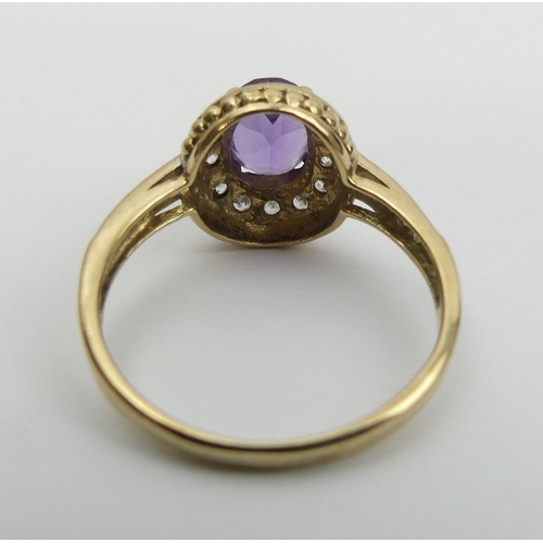 17 - 9ct gold amethyst and white spinel ring, 2.6 grams. Size P, 12.2 mm. UK Postage £12.