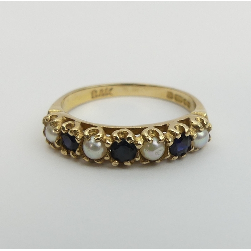 21 - 9ct gold sapphire and seed pearl ring, London 1975. 2 grams, Size M, 4.3 mm wide. UK Postage £12.