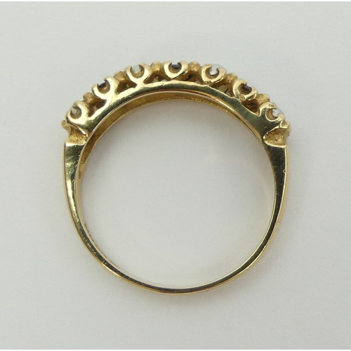 21 - 9ct gold sapphire and seed pearl ring, London 1975. 2 grams, Size M, 4.3 mm wide. UK Postage £12.