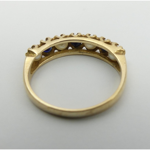 21 - 9ct gold sapphire and seed pearl ring, London 1975. 2 grams, Size M, 4.3 mm wide. UK Postage £12.