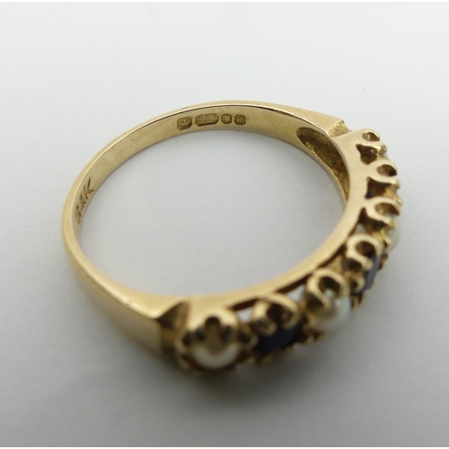 21 - 9ct gold sapphire and seed pearl ring, London 1975. 2 grams, Size M, 4.3 mm wide. UK Postage £12.