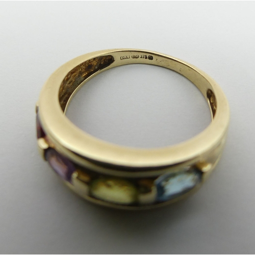 7 - 9ct gold peridot, topaz, amethyst and garnet ring. Size M 1/2, 7.2 mm wide. UK Postage £12.