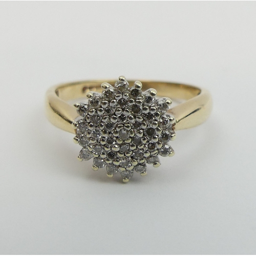 25 - 9ct gold diamond cluster ring, 3.1 grams, size O 11.3mm wide.  UK Postage £12.