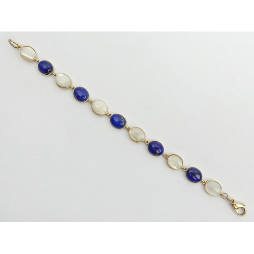 26 - 9ct gold lapis and moonstone cabochon bracelet, 10 grams, 17.5cm x 8.8mm. Postage £12