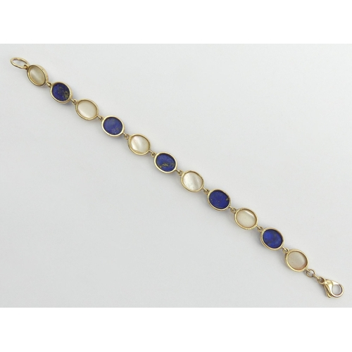 26 - 9ct gold lapis and moonstone cabochon bracelet, 10 grams, 17.5cm x 8.8mm. Postage £12