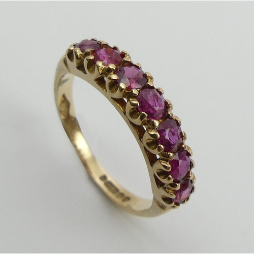 27 - 9ct gold seven stone ruby ring, 2 grams, size L 4.5mm wide.  UK Postage £12.