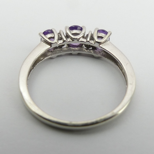 29 - 9ct white gold purple sapphire and diamond ring, 
2.3 grams, size N 5.2mm wide.  UK Postage £12.