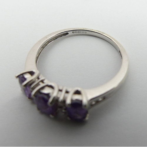 29 - 9ct white gold purple sapphire and diamond ring, 
2.3 grams, size N 5.2mm wide.  UK Postage £12.