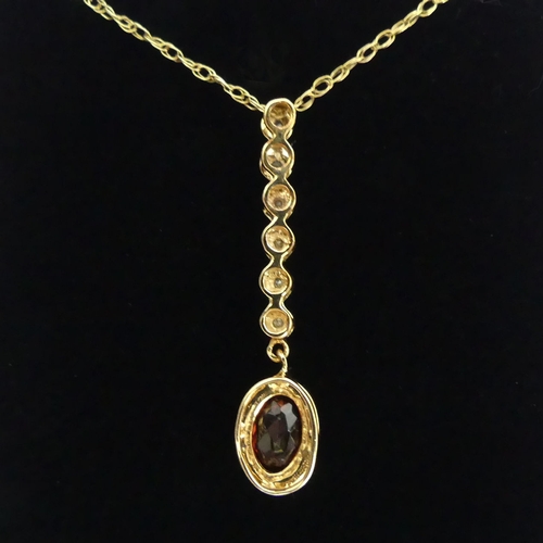 34 - 9ct gold diamond and garnet pendant and chain, 1.8 grams
chain 41cm pendant 31mm.  UK Postage £12.