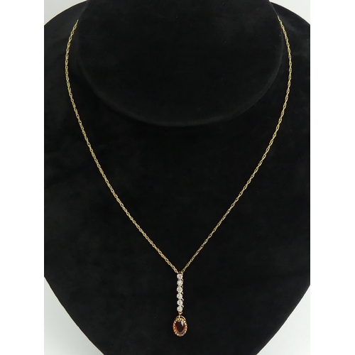 34 - 9ct gold diamond and garnet pendant and chain, 1.8 grams
chain 41cm pendant 31mm.  UK Postage £12.