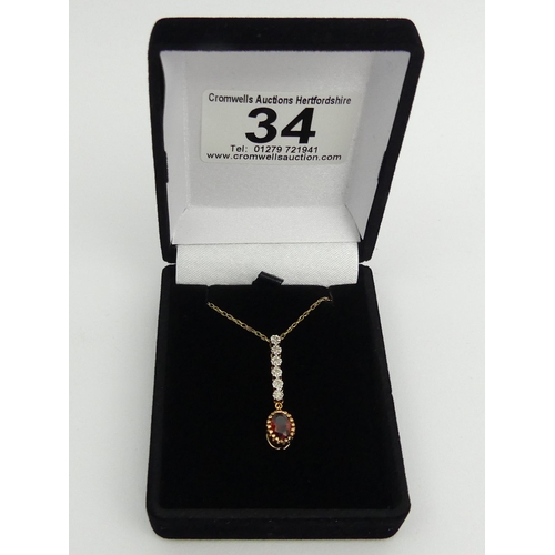 34 - 9ct gold diamond and garnet pendant and chain, 1.8 grams
chain 41cm pendant 31mm.  UK Postage £12.