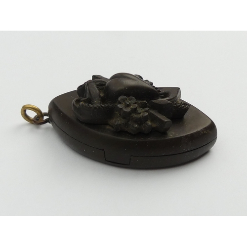 39 - Victorian vulcanite locket pendant, 13.5 grams, 50mm long,
 UK Postage £12.