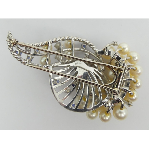 40A - 14ct white gold, cultured pearl, sapphire and diamond brooch, 27.3 grams, 62 x 35mm.
UK Postage £12