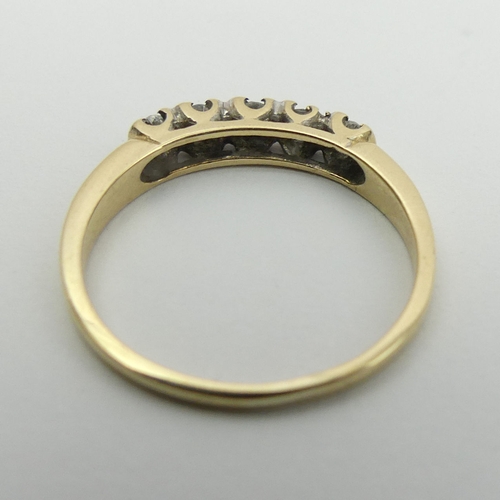 41 - 9ct gold five stone diamond ring, 1.3 grams, Size J, 2.8mm. UK Postage £12.