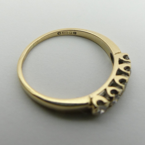 41 - 9ct gold five stone diamond ring, 1.3 grams, Size J, 2.8mm. UK Postage £12.