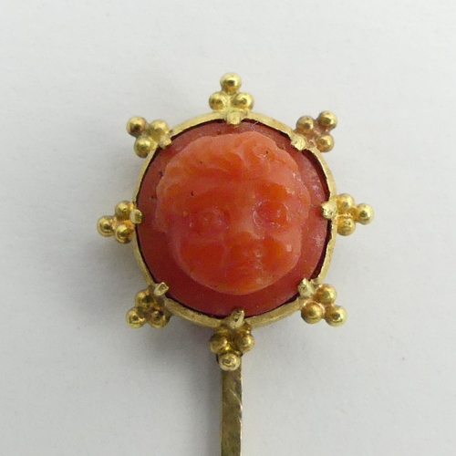 47 - Gold Victorian carved coral stick pin, 1.6 grams, 62mm wide. UK Postage £12.