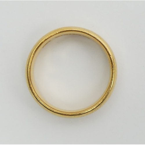 51 - 22ct gold wedding ring, London 1921, 7.8 grams, Size N, 5.1mm wide. UK Postage £12