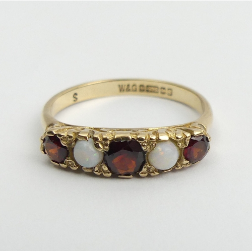 53 - 9ct gold garnet and opal five sone ring, 2.5 grams, Birm. 1967, Size P, 5mm wide. UK Postage £12