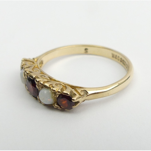 53 - 9ct gold garnet and opal five sone ring, 2.5 grams, Birm. 1967, Size P, 5mm wide. UK Postage £12