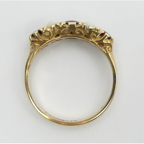53 - 9ct gold garnet and opal five sone ring, 2.5 grams, Birm. 1967, Size P, 5mm wide. UK Postage £12