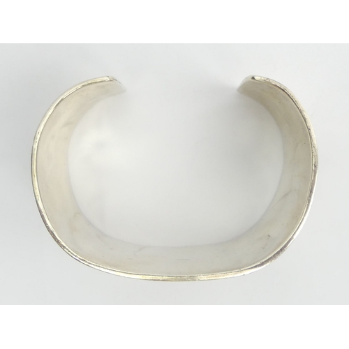 56 - Native American silver Bear design cuff bangle, 86.5 grams, Edinburgh 2001, 41mm wide. 
UK Postage £... 