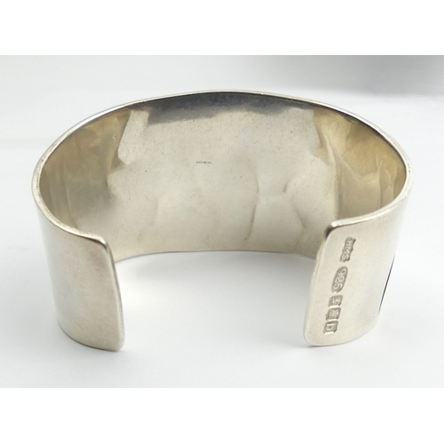 56 - Native American silver Bear design cuff bangle, 86.5 grams, Edinburgh 2001, 41mm wide. 
UK Postage £... 