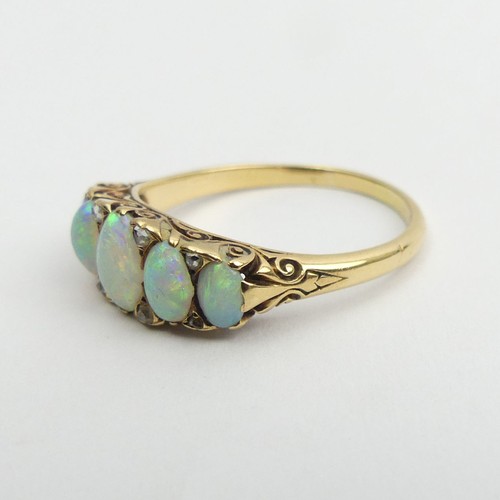 49 - 18ct gold, tested, opal five stone ring with diamond points. 3.9 grams, Size Q1/2, 7.4mm wide. 
UK P... 